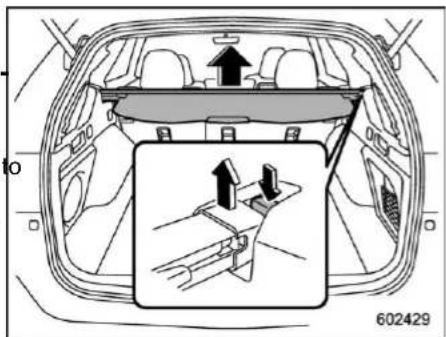 Diagram showing car interior with directional arrows and a magnified view of the dashboard, likely illustrating vehicle movement or safety instructions.