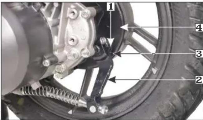 Labeled mechanical assembly diagram showing components of a vehicle wheel and suspension system