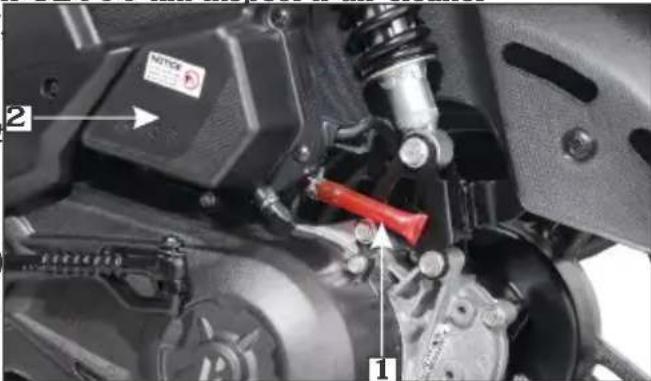 Close-up mechanical assembly diagram with labeled parts and directional arrows indicating motion or force directions