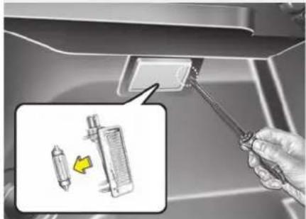 Instructional diagram showing a hand using a tool to adjust or install a device, with an inset image highlighting the device's internal structure.