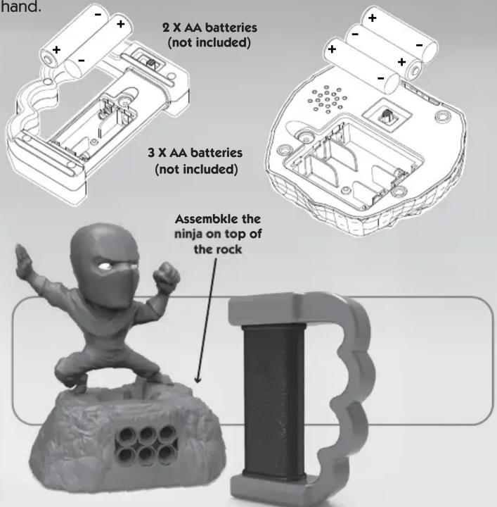 hand. 2 X AA batteries (not included) 3 X AA batteries (not included) Assemble the ninja on top of the rock