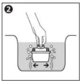 Diagram showing a hand pressing a container with directional arrows indicating fluid flow or movement, labeled with number 2.