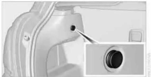 Close-up of a mechanical component with a close-up inset showing a circular opening (no text or symbols visible)