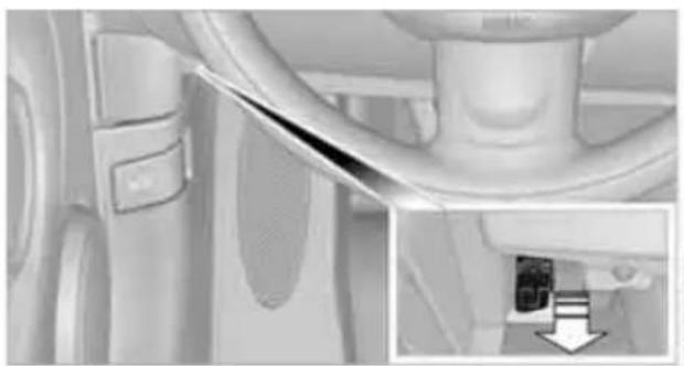 Close-up of a car interior showing a cable and seatbelt, with an inset close-up of a small electronic device (no visible text or symbols)