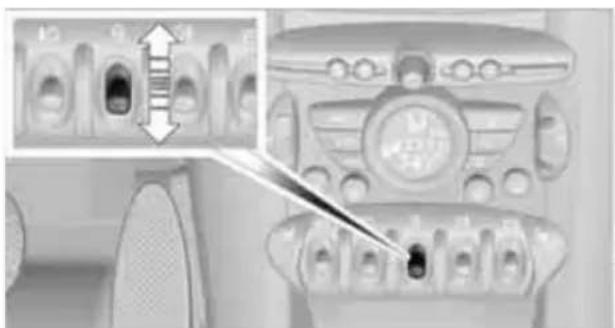 Close-up of a car air conditioner panel with a magnified inset showing internal components (no visible text or symbols)