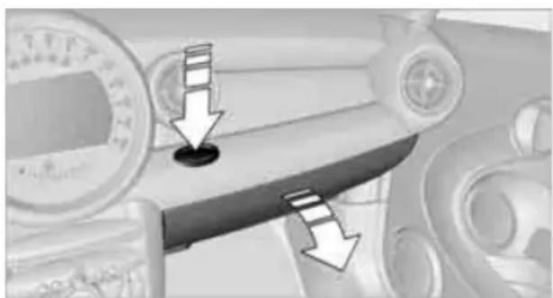 Mechanical component with arrows indicating downward motion, no visible text or symbols