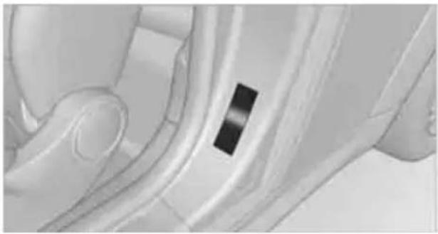 Close-up of a car interior showing the wheel and dashboard (no visible text or symbols)