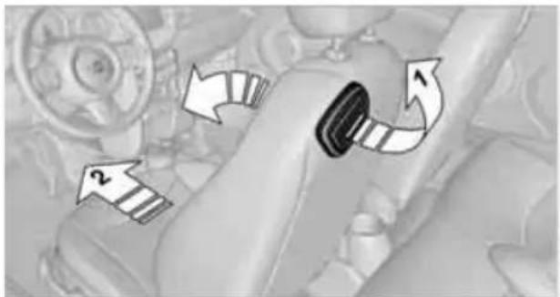 Close-up of a car's seatbelt mechanism with directional arrows indicating rotation (no text or symbols)