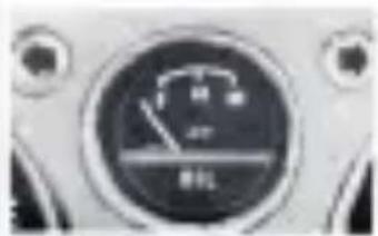 Close-up of a circular industrial control dial with Chinese characters and a gauge showing measurement markings