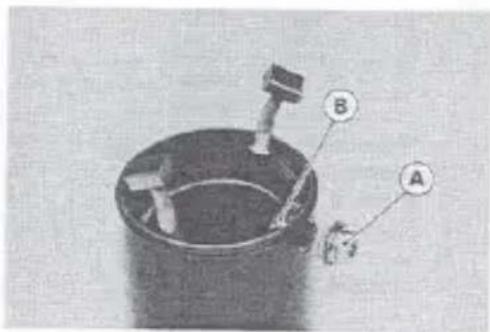 Labeled diagram of a mechanical device with parts A and B, showing internal components and connections.