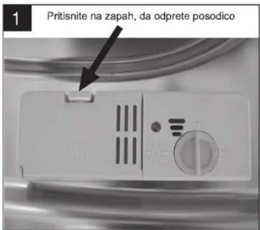 1 Pritisnite na zapah, da odprete posodico