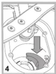 Mechanical assembly diagram showing a rotating component with a downward arrow indicating motion (no text or symbols)