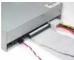 Close-up of a silver printer with paper sheets and red cables inserted (no visible text or symbols)