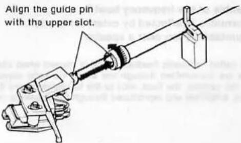 Align the guide pin with the upper slot.