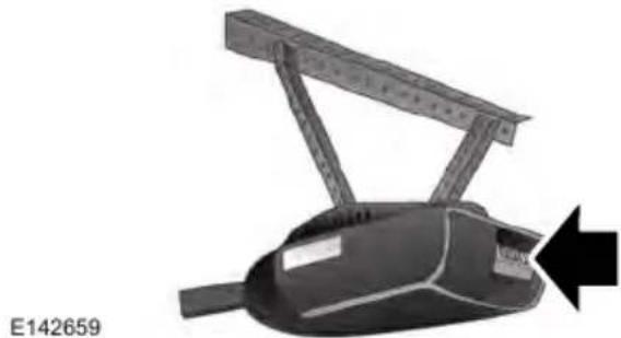 Mechanical device with lever and attached frame, shown with a black arrow pointing to a component (no text or symbols on the device itself)