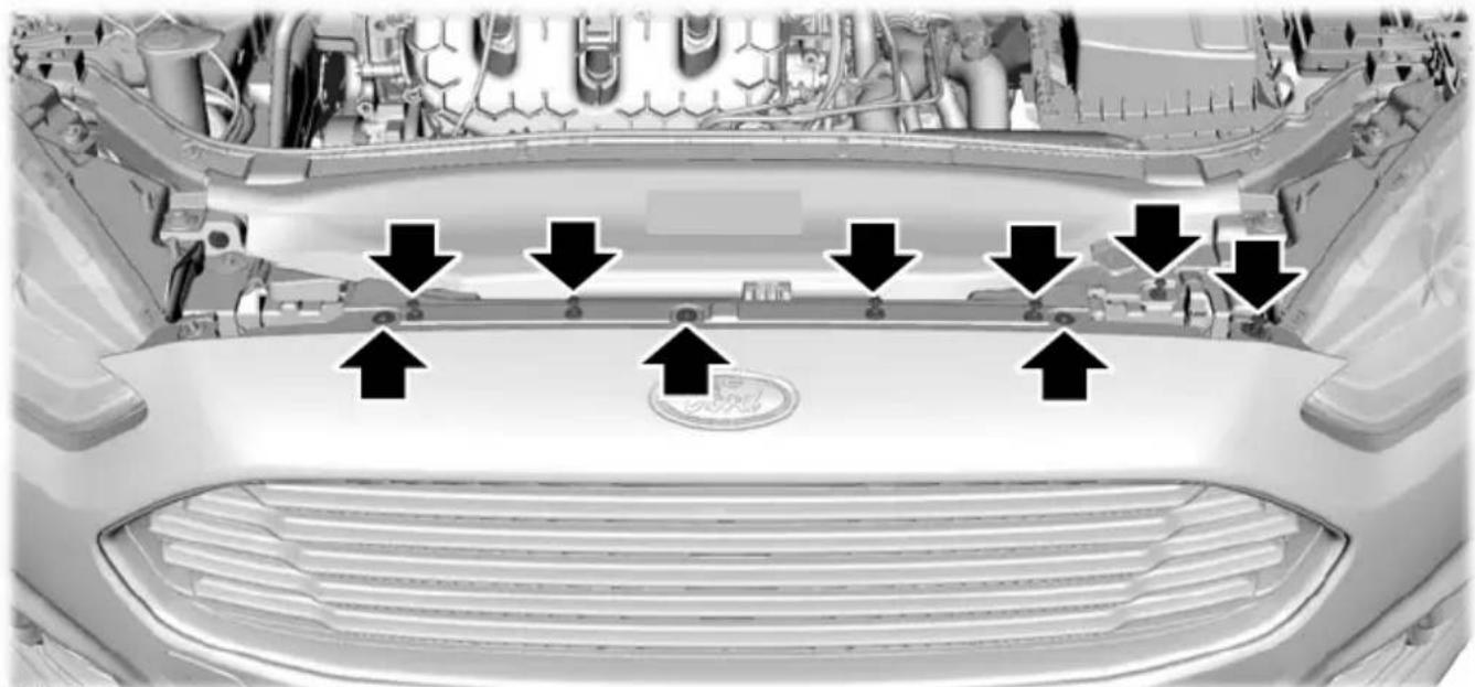 Top-down view of a car's front grille and engine compartment with black arrows pointing to structural elements (no text or symbols)
