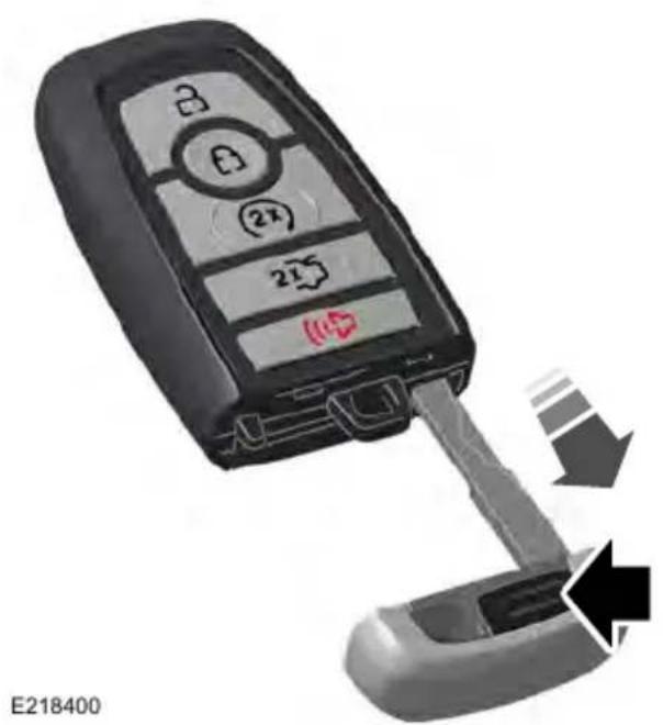 Close-up of a car key with a lock and sensor interface, showing a disassembly or disassembly process (no text or symbols on the main object)