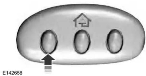 Close-up of a control panel with three ovals and a house icon, no readable text or symbols