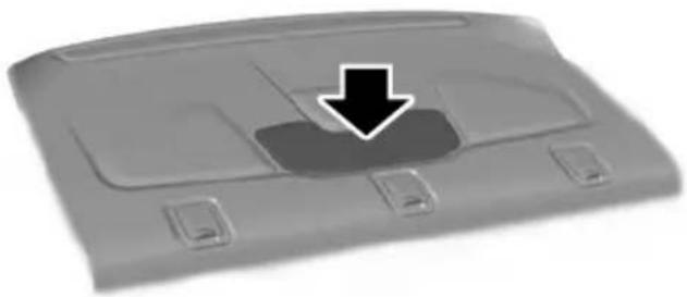 Top-down view of a car rear cover with a black arrow pointing to a specific area (no text or symbols visible)