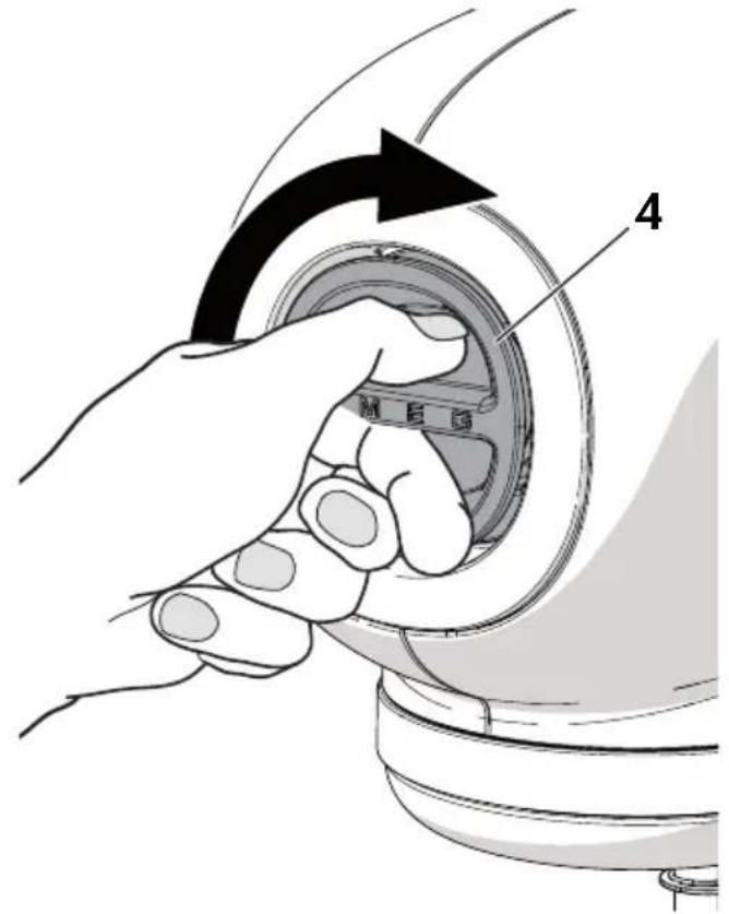 Diagram showing hand turning a component with labeled parts and directional arrow