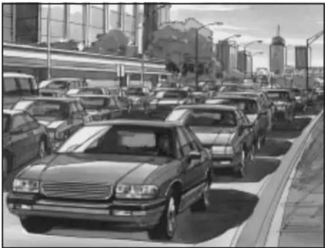 Black-and-white street scene showing a convoy of cars driving on a city road with modern buildings and a skyscraper in the background (no visible text or signage)