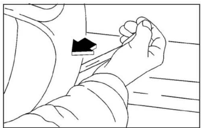 Line drawing of a person's arm and hand holding a small object, no text or symbols present