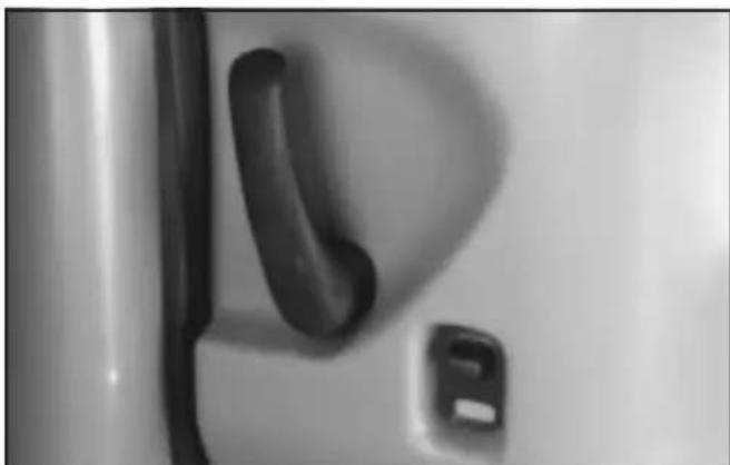 Close-up of a door handle and keyhole (no text or symbols visible)
