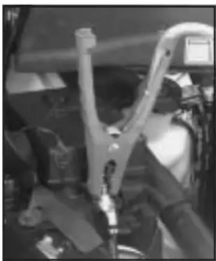 Interior view of a vehicle cockpit with visible mechanical components and no text or symbols