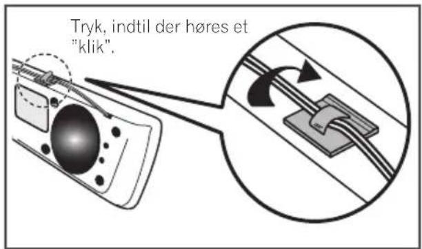 Tryk, indtil der høres et "klik".