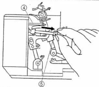 Technical diagram showing a hand using a tool to adjust or install a mechanical component, with numbered parts and directional arrow indicating motion.
