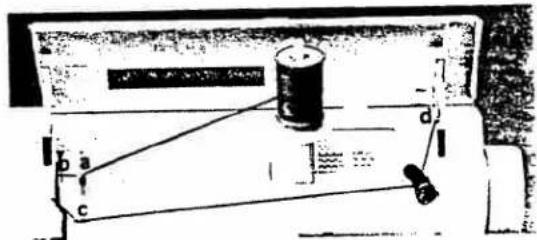 Diagram of a physics experiment setup with labeled components and motion indicators