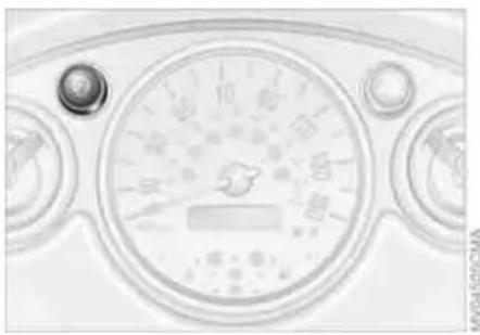 Close-up of a car dashboard with gauges and control buttons (no readable text or symbols)