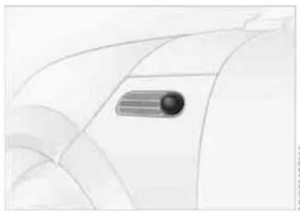 Abstract curved line drawing with a dark oval shape on the left side (no text or symbols)