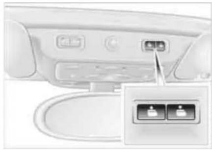 Interior view of a modern appliance rear panel with two buttons and a connector (no visible text or symbols)