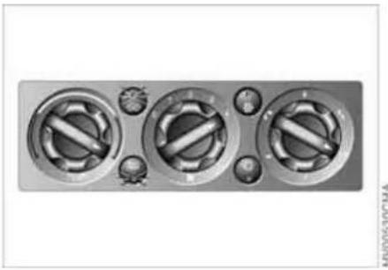 Close-up of a metallic industrial control panel with three rotary buttons and adjustment knobs (no visible text or symbols)