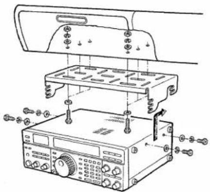 Technical diagram showing assembly of a device with labeled components and parts, including a control panel and instrument.