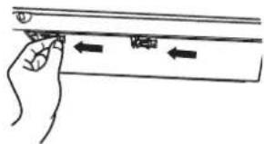 Diagram showing hand pressing a component with directional arrows indicating movement or force