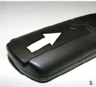 Close-up of a black leather or rubber object with a white arrow pointing upward (no text or symbols visible)