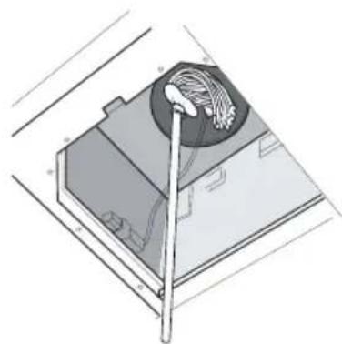 Technical illustration of a mechanical device with a tool inserted, showing internal wiring and components (no text or symbols)