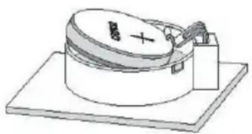 Diagram of a cylindrical device with a battery and screw, mounted on a base plate (no text or symbols)