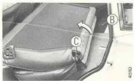 Technical diagram of a car seatbelt with labeled parts C and B, showing structural components and directional arrow.