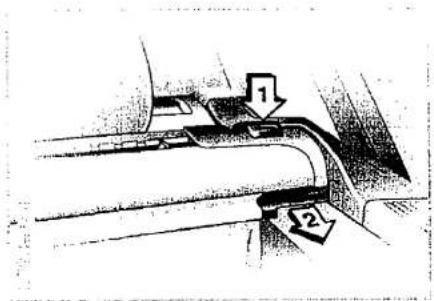 Technical diagram showing two labeled components (1 and 2) with arrows indicating flow or movement, likely from an engineering or mechanical context.