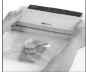 Close-up of hands holding a white electronic device with a transparent cover and circular components (no visible text or symbols)