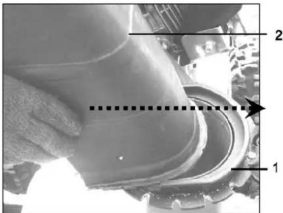Technical diagram showing a mechanical component with labeled parts 1 and 2, and a dashed line indicating a measurement or alignment.