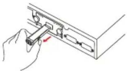 Illustration of a hand inserting a component into a rack (no text or symbols visible)