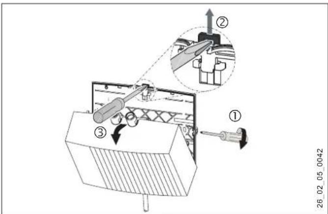 Technical diagram showing a mechanical assembly with labeled components and an inset view of a tool interacting with a component.