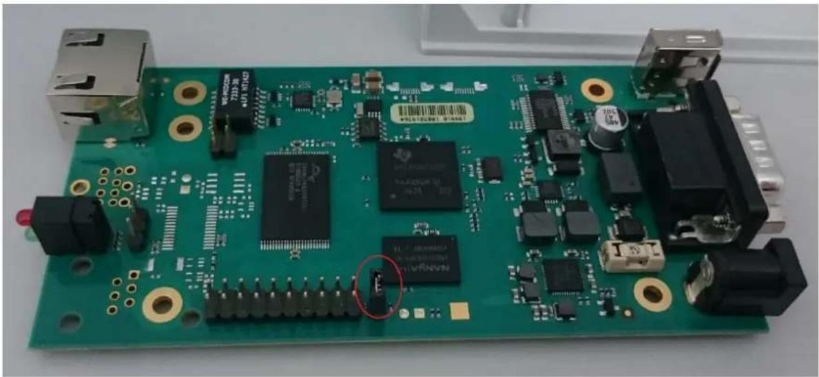 Green printed circuit board with various electronic components and connectors (no readable text or symbols)
