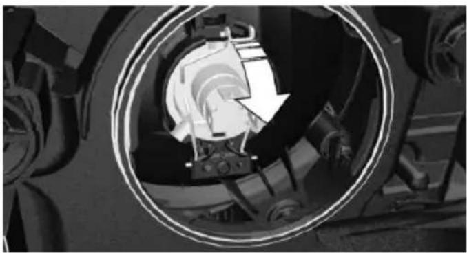 Close-up of a mechanical assembly showing a circular component with internal components and a directional arrow (no visible text or symbols)