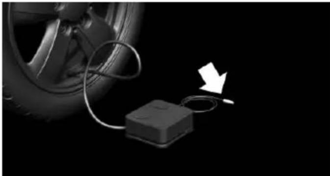 Diagram showing a car wheel connected to a battery with a cable, and a white arrow pointing downward (no text or symbols present)
