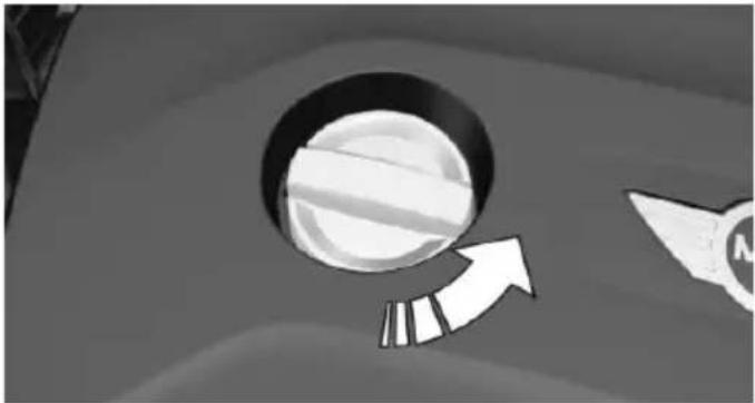 Close-up of a circular object with a diagonal arrow pointing to it, next to a partial view of a mechanical component (no text or symbols visible)